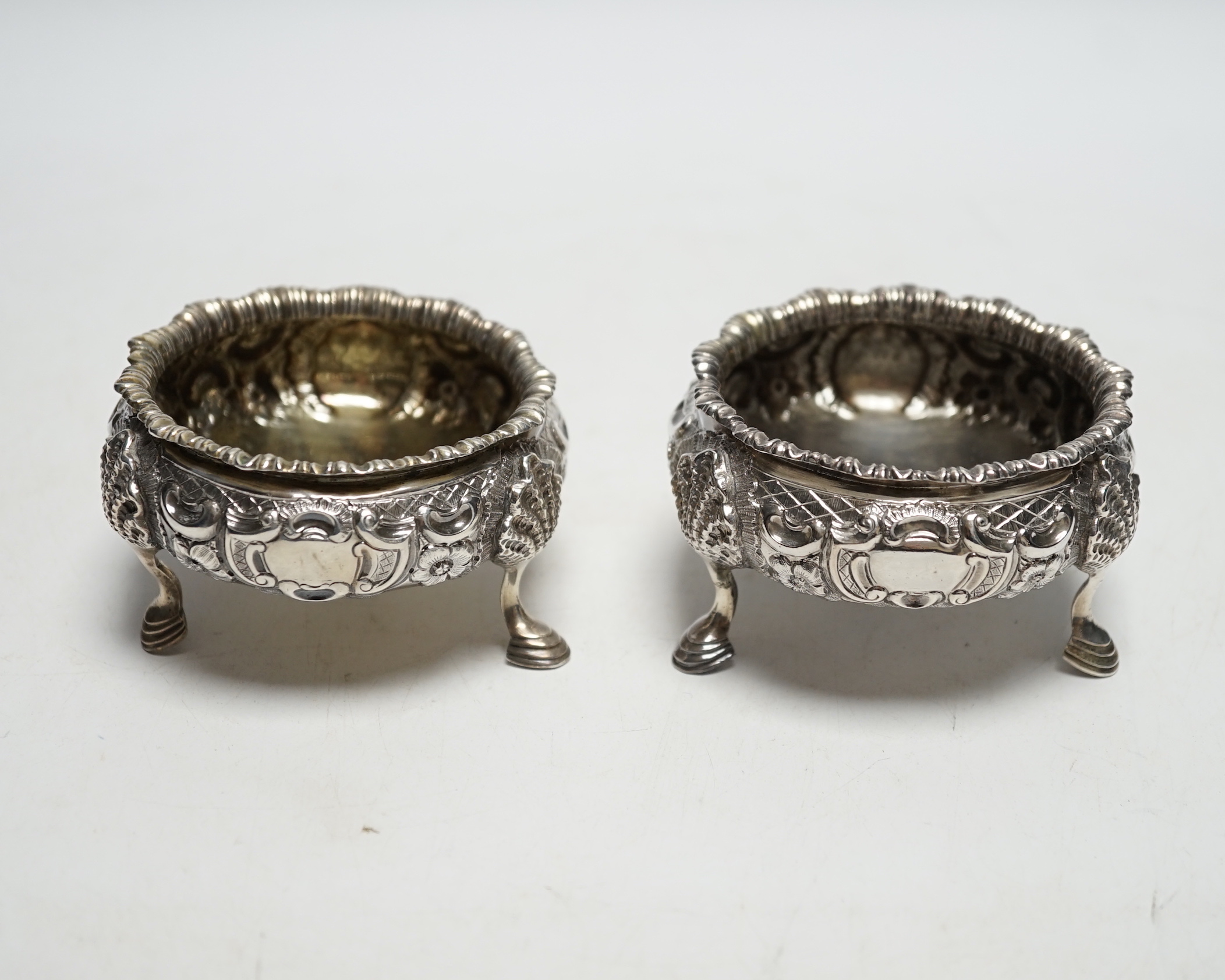 A pair of Victorian embossed silver bun salts, London, 1848, diameter 75mm.